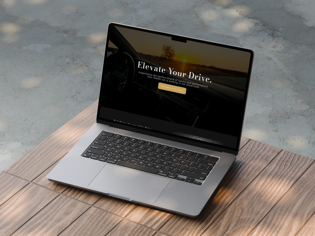 MacBook Air on an outdoor wooden table displaying a luxury automotive website design titled Elevate Your Drive.